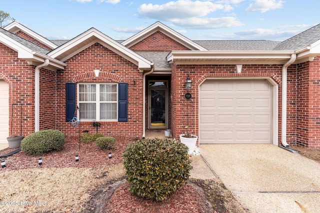 ranch-style home featuring a garage