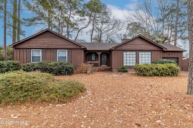 single story home featuring a garage