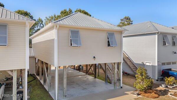 rear view of house with a carport