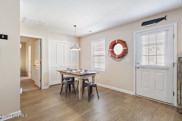 dining area featuring hardwood / wood-style flooring and a wealth of natural light