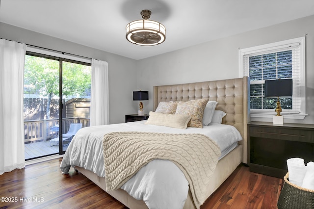 bedroom featuring dark hardwood / wood-style floors and access to outside