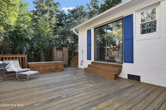 deck featuring a hot tub