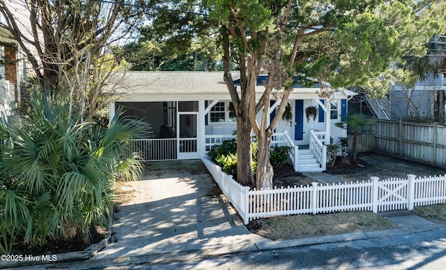 view of front of home with a sunroom