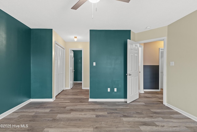 spare room featuring hardwood / wood-style floors and ceiling fan