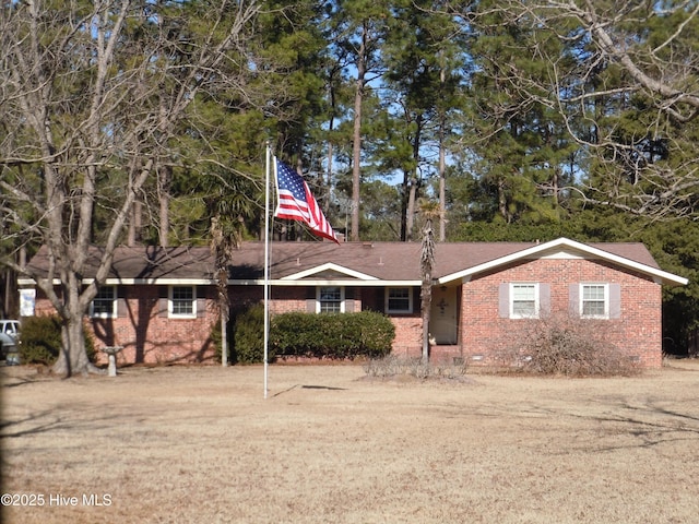 ranch-style house with a front lawn