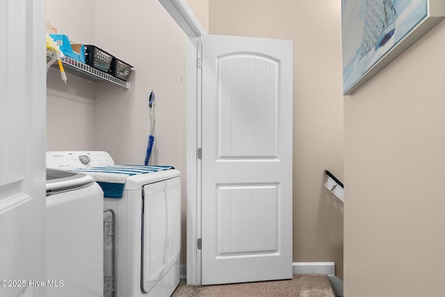 clothes washing area featuring washing machine and clothes dryer