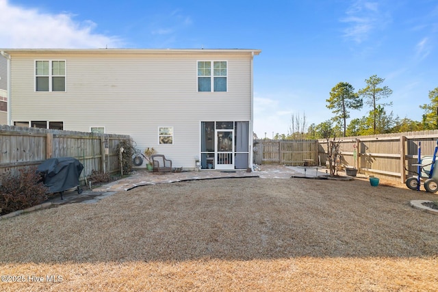 back of property featuring a patio