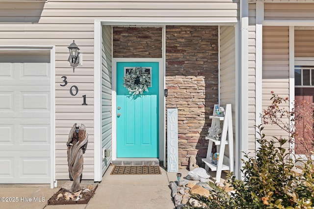 entrance to property featuring a garage