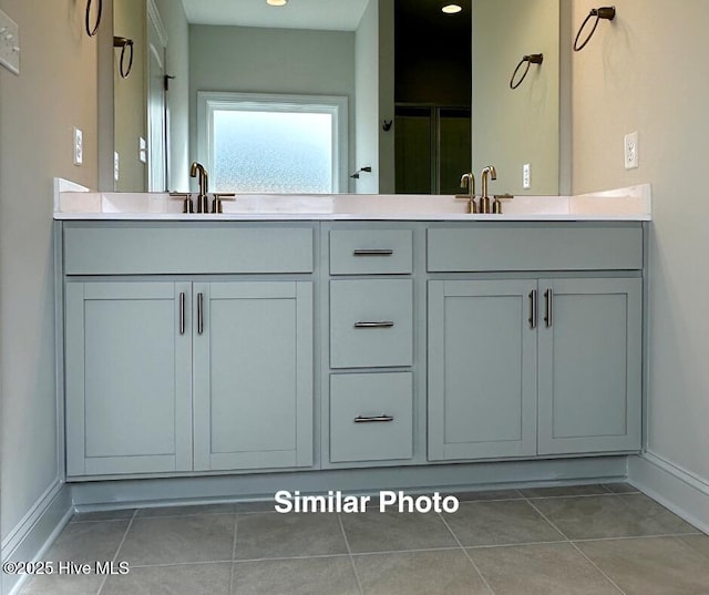 bathroom featuring tile patterned floors and vanity