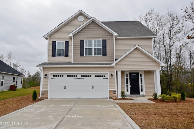 view of front facade with a garage and a front yard