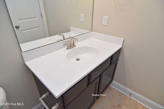 bathroom with vanity and tile patterned flooring