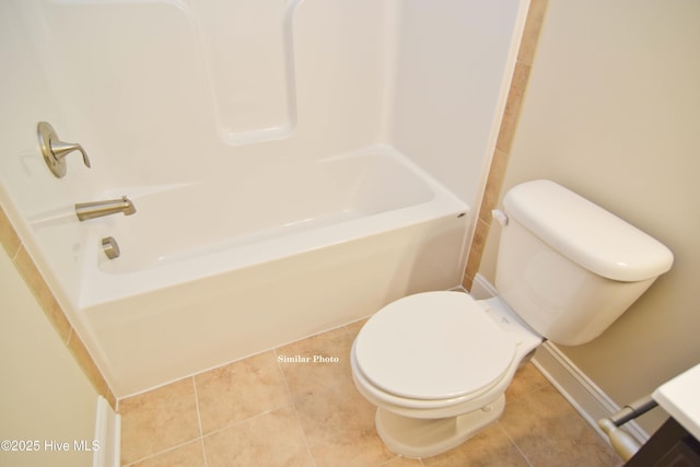 bathroom featuring tile patterned flooring, shower / tub combination, and toilet