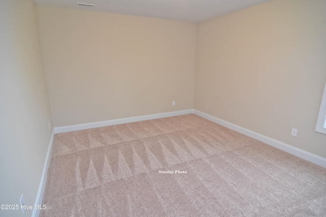 spare room featuring carpet flooring