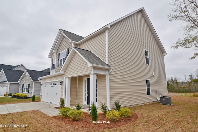 view of home's exterior with cooling unit, a garage, and a lawn