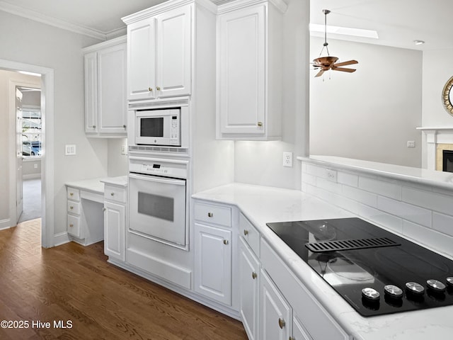 kitchen featuring white cabinetry, white appliances, crown molding, and dark hardwood / wood-style floors