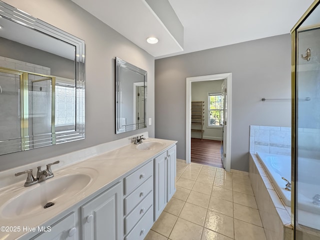 bathroom featuring vanity, independent shower and bath, and tile patterned flooring