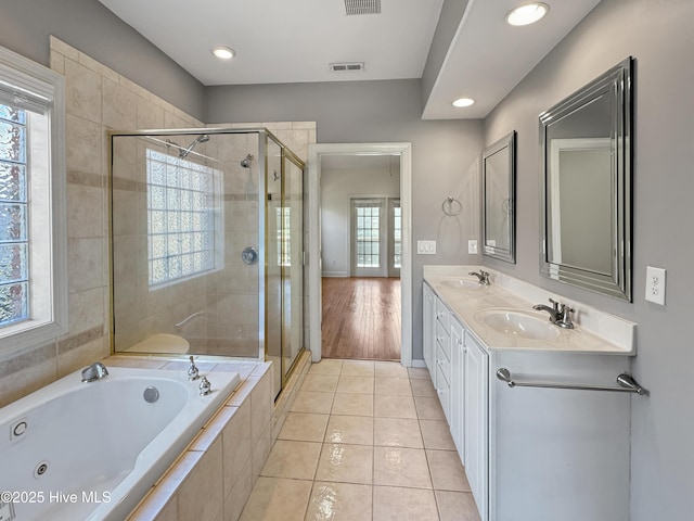 bathroom featuring tile patterned flooring, vanity, and independent shower and bath