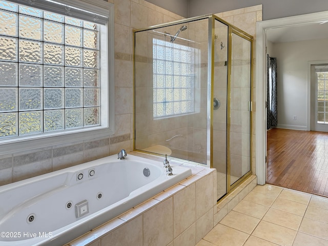 bathroom with tile patterned floors and separate shower and tub