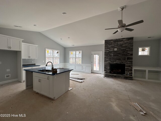 unfurnished living room with lofted ceiling