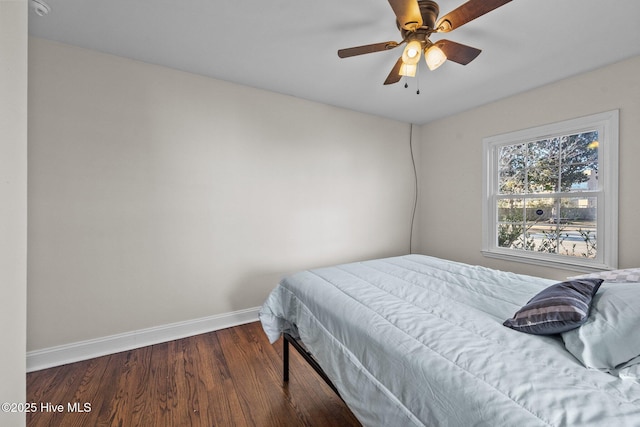 bedroom with hardwood / wood-style flooring and ceiling fan