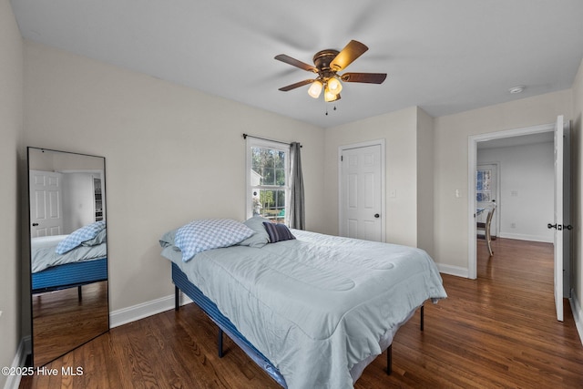 bedroom featuring dark hardwood / wood-style floors and ceiling fan