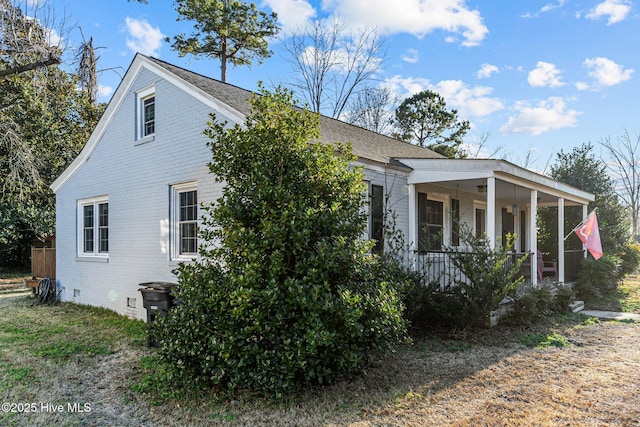 view of home's exterior featuring covered porch