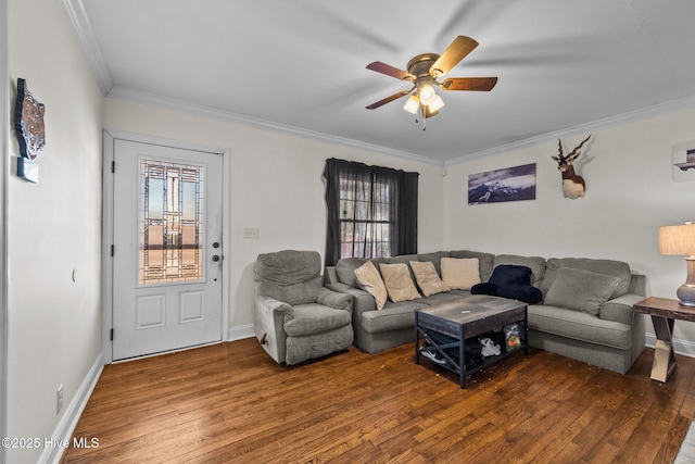 living room with crown molding, wood-type flooring, and ceiling fan