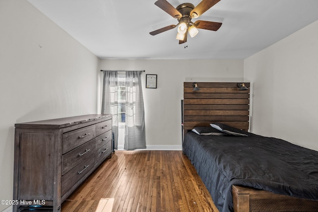 bedroom featuring ceiling fan and dark hardwood / wood-style flooring