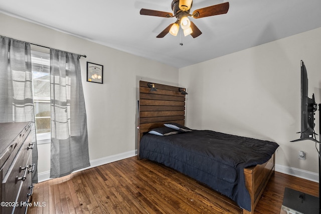 bedroom featuring ceiling fan and dark hardwood / wood-style floors