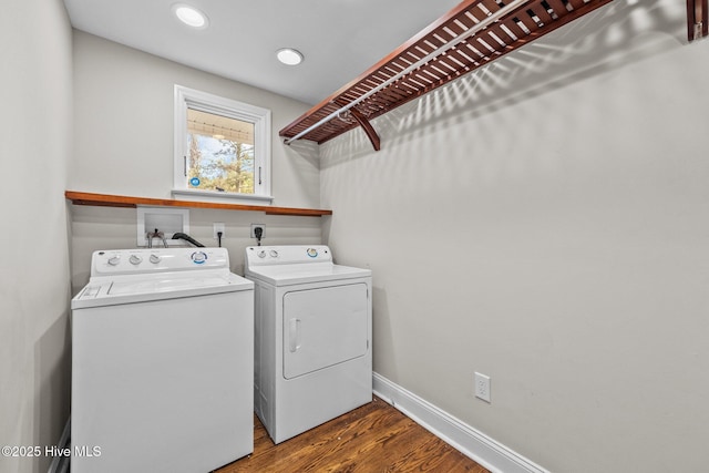 laundry area featuring wood-type flooring and washer and clothes dryer