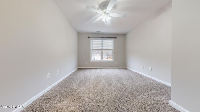 carpeted empty room with ceiling fan