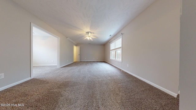 unfurnished room featuring carpet flooring and a textured ceiling