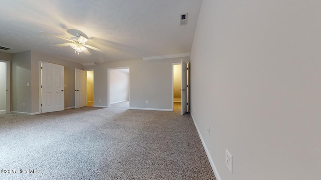 carpeted empty room with ceiling fan