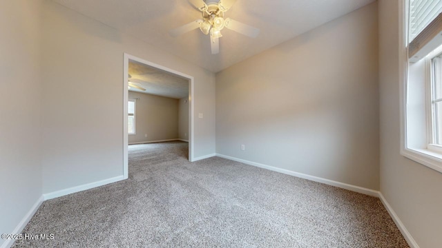 empty room featuring carpet and ceiling fan