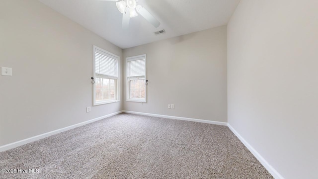 carpeted spare room with ceiling fan