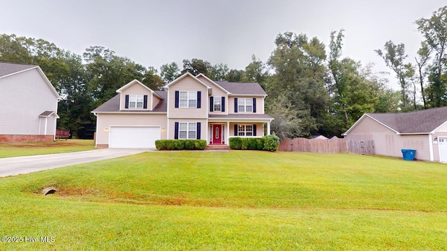 colonial home with a garage and a front lawn