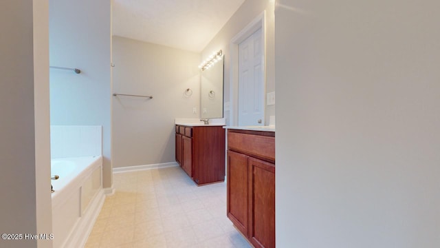 bathroom with vanity and a bathtub