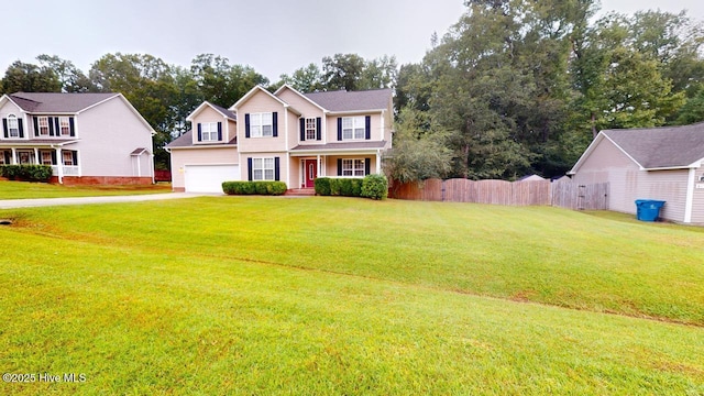 colonial house featuring a garage and a front lawn