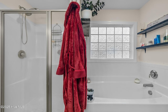 bathroom featuring separate shower and tub