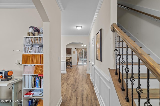 hall featuring crown molding and hardwood / wood-style floors