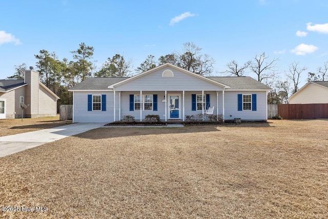 ranch-style house with a front lawn and covered porch