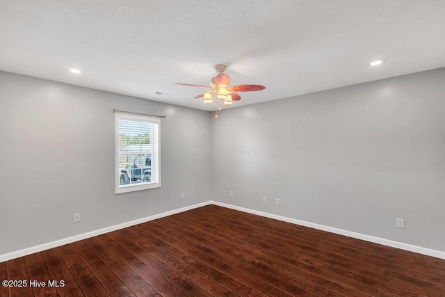 empty room with hardwood / wood-style flooring and ceiling fan