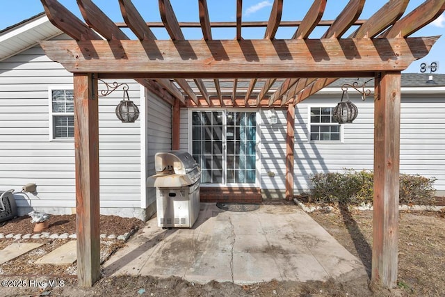 view of patio / terrace featuring grilling area and a pergola