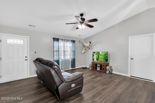 living room with ceiling fan, lofted ceiling, and dark hardwood / wood-style flooring