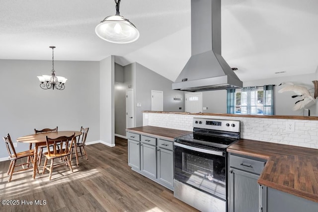 kitchen featuring wood counters, hanging light fixtures, stainless steel range with electric stovetop, and island exhaust hood