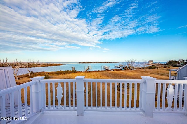 wooden deck with a water view