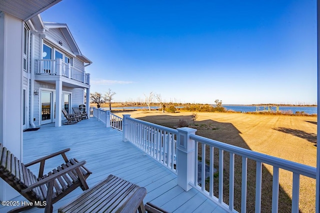 wooden deck with a water view