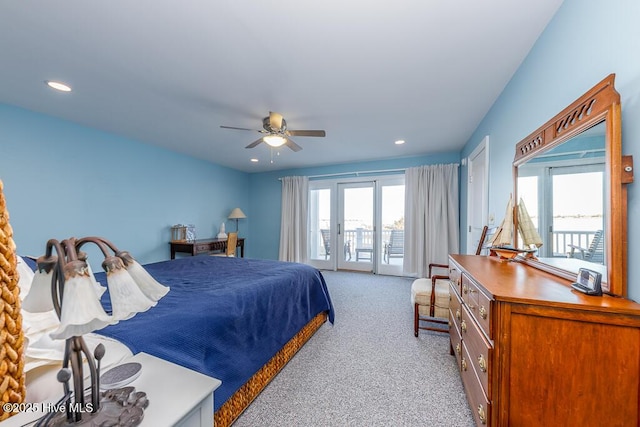 bedroom featuring french doors, light colored carpet, access to exterior, and ceiling fan