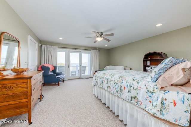 bedroom featuring ceiling fan, light colored carpet, french doors, and access to outside