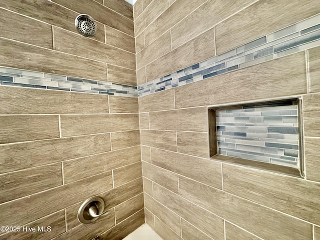 room details with a tile shower